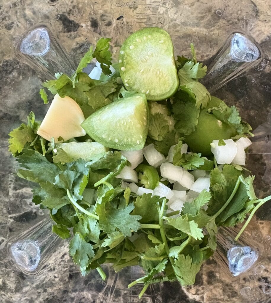 Avocado salsa verde ingredients in blender