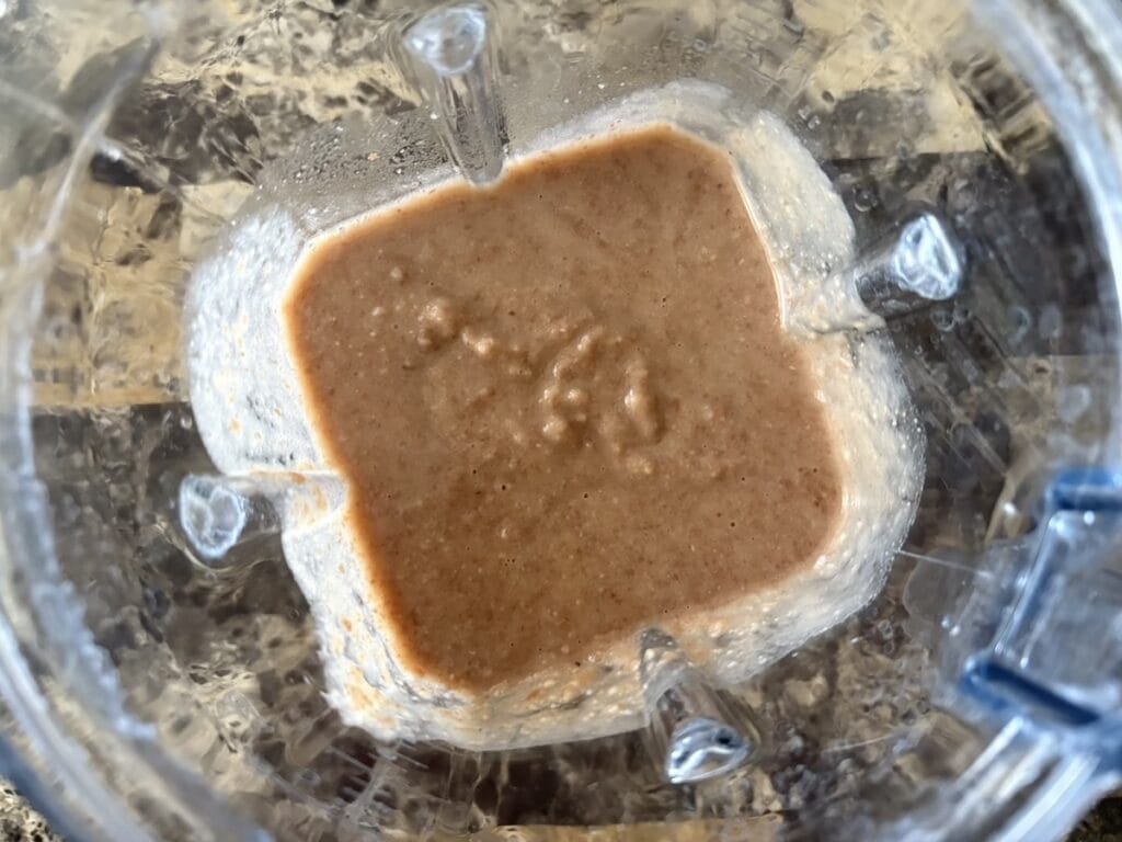 Top view of beans in a blender after they have been pureed.