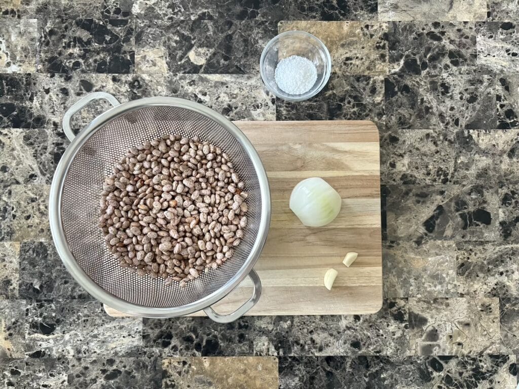 Top view of ingredients for frijoles de olla or Mexican simmered beans.