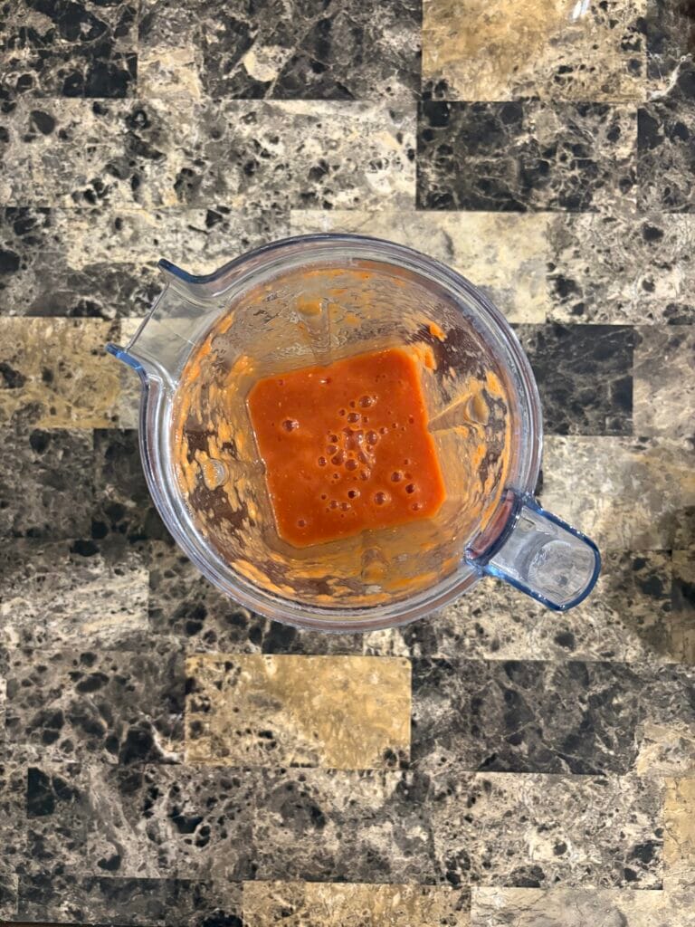 Top view of chipotle meatball sauce ingredients after blending.